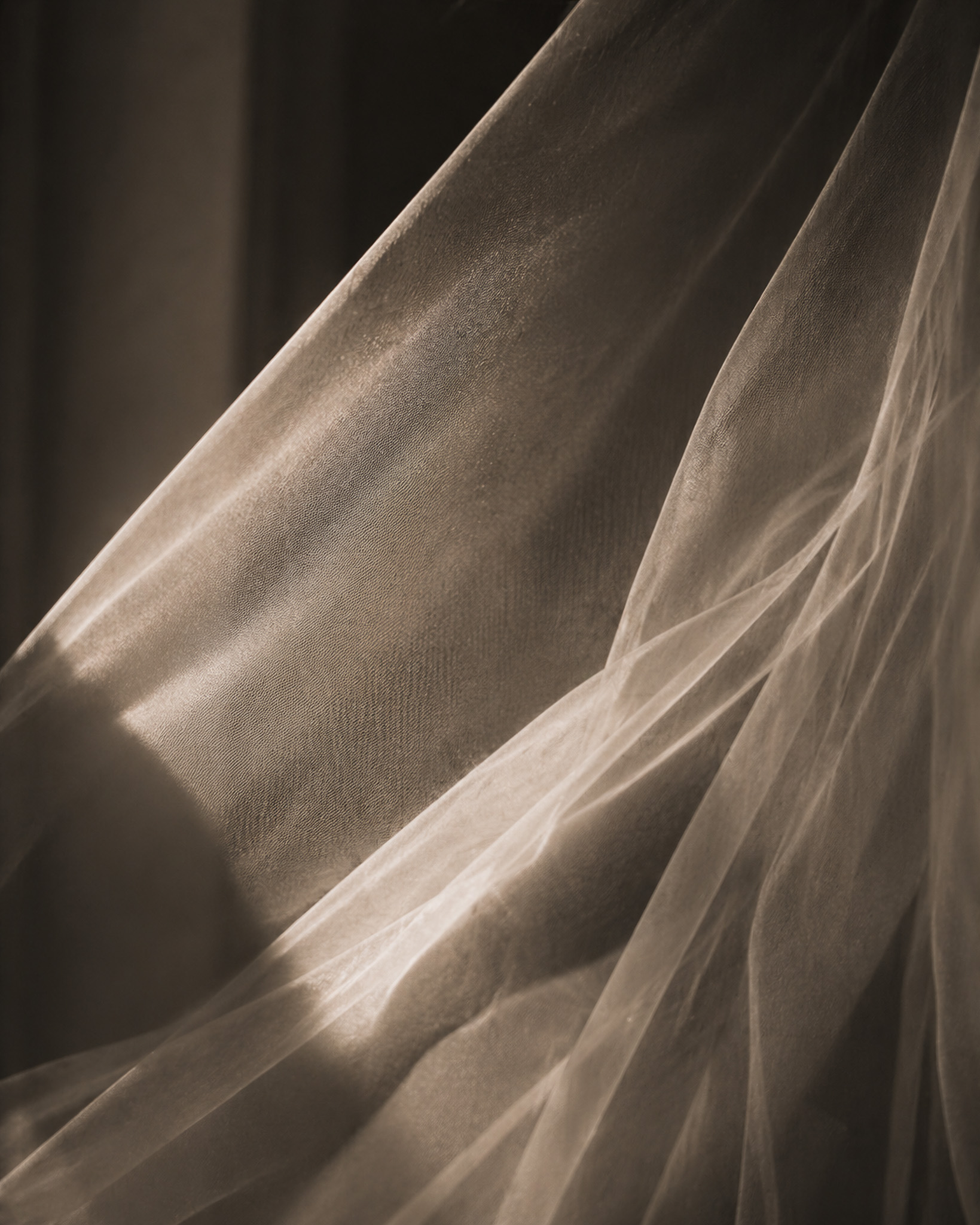 Private wedding moment — bride by window