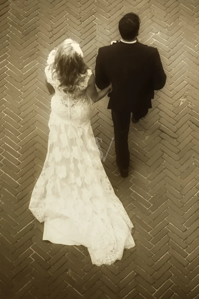 Bride and groom walking together from above