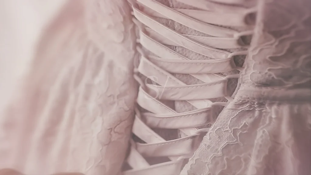 Close detail of lacing and lace fabric on a wedding dress
